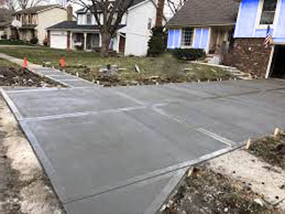 Why is asphalt better than concrete for driveway installations